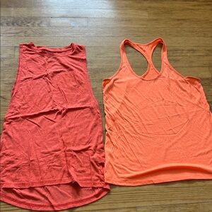 Workout tops (2) Women's Sleeveless Tops - Red and Orange adidas and under armor